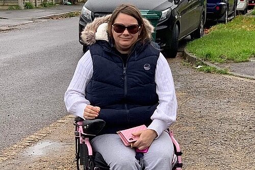 Victoria using her wheelchair on the improved pavement