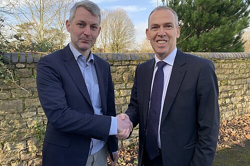 Will Forster and Paul Kennedy shaking hands